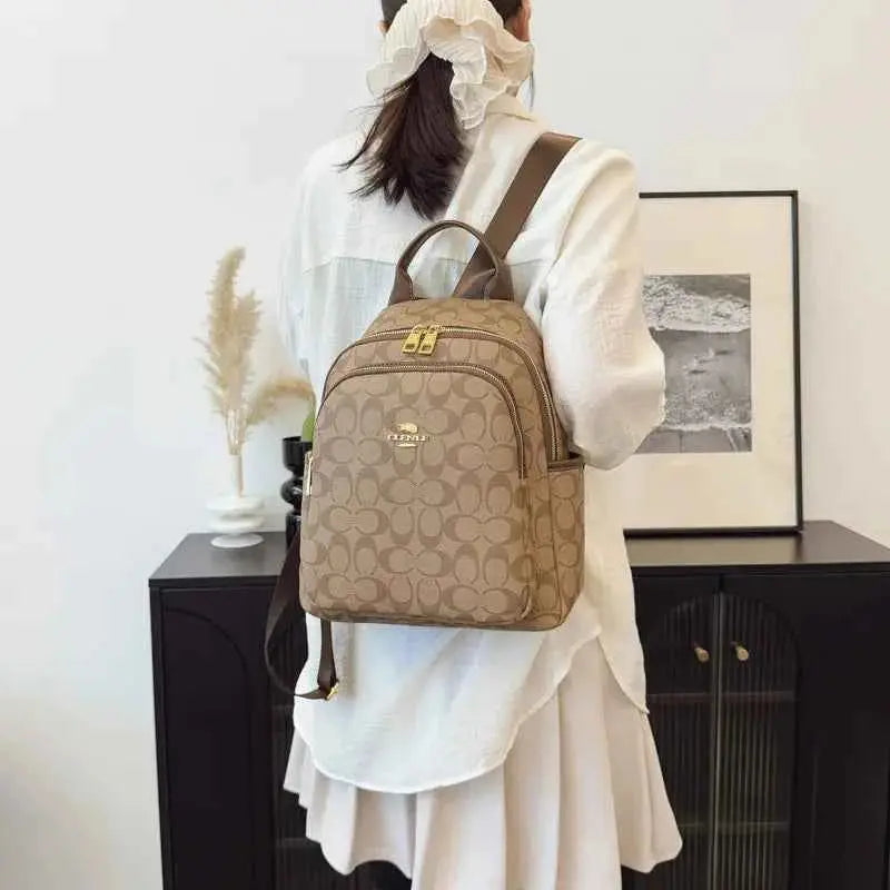 Large-capacity casual women's backpack with vintage textured coating, suitable for travel.